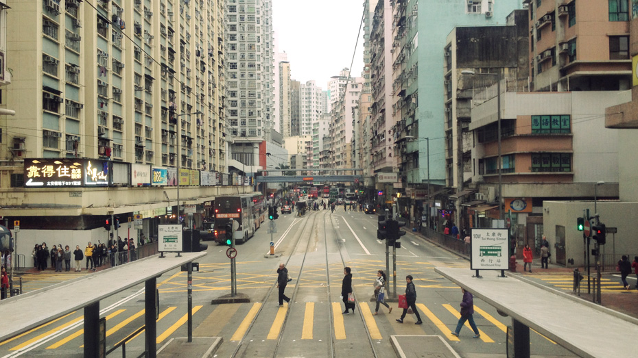 Photograph of a street scene in Hong Kong, taken from the Hong Kong tram